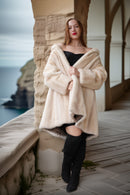 Pearl mink swing coat with hood, cream fur, wrap-style front, flared sleeves