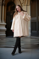 Cream mink coat, front angle with plush collar and slightly flared hem