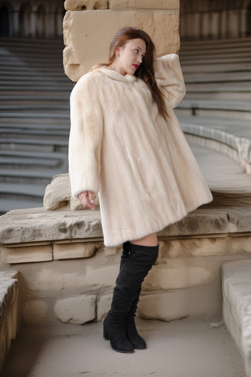 Cream mink coat, side view with plush collar and voluminous swing shape