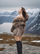 Back view of Raccoon Glamour Jacket - Mountain Mirage S/M with fur draped off-shoulder, emphasizing natural raccoon fur and winter elegance.