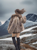 Back angle of Raccoon Glamour Jacket - Mountain Mirage S/M in snowy mountains, emphasizing natural fur flow and premium design.