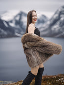 Raccoon Glamour Jacket - Mountain Mirage S/M styled with black dress, highlighting fur movement and alpine elegance.