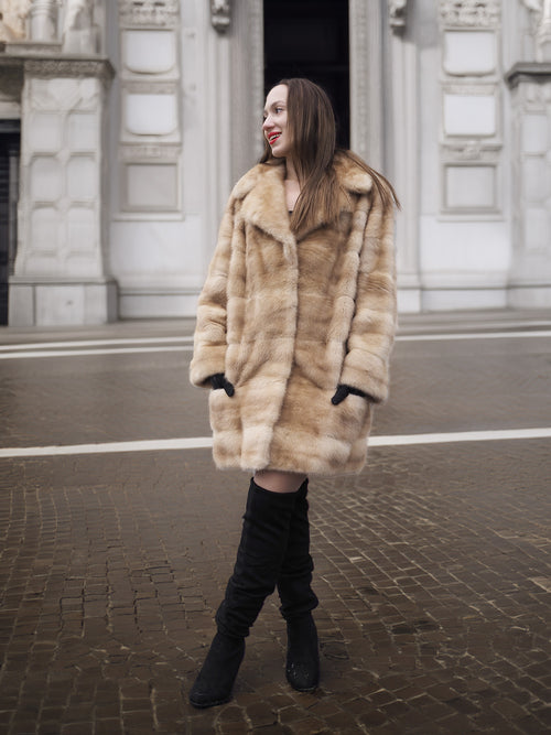 Modern blond pastel mink fur coat stroller jacket worn open, perfect for upscale winter fashion and sustainable fur lovers.