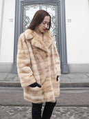 Front view of blond pastel mink fur coat stroller jacket, showcasing its soft texture and modern cut for winter elegance.
