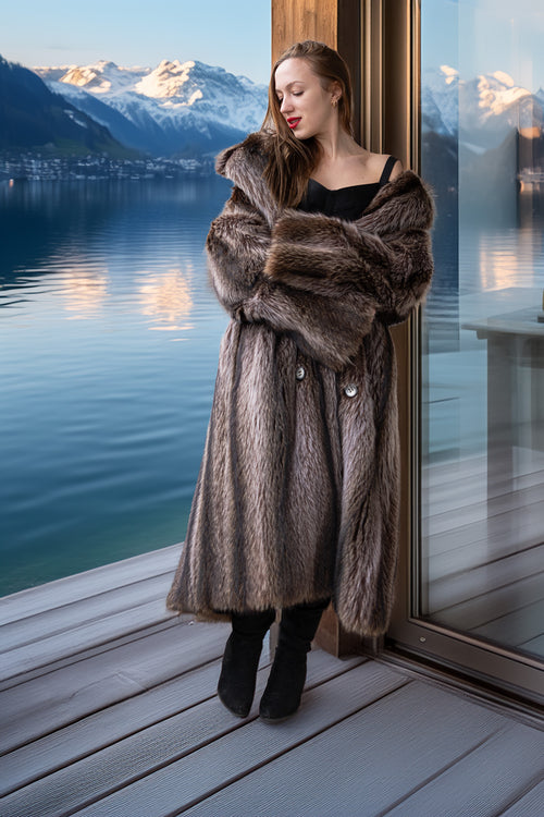 Raccoon fur double-breasted coat with notched lapels, silver buttons, long straight cut
