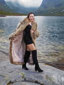 Open Finnish Raccoon Fur Coat revealing satin lining, paired with black mini dress and boots, styled for chic winter fashion.