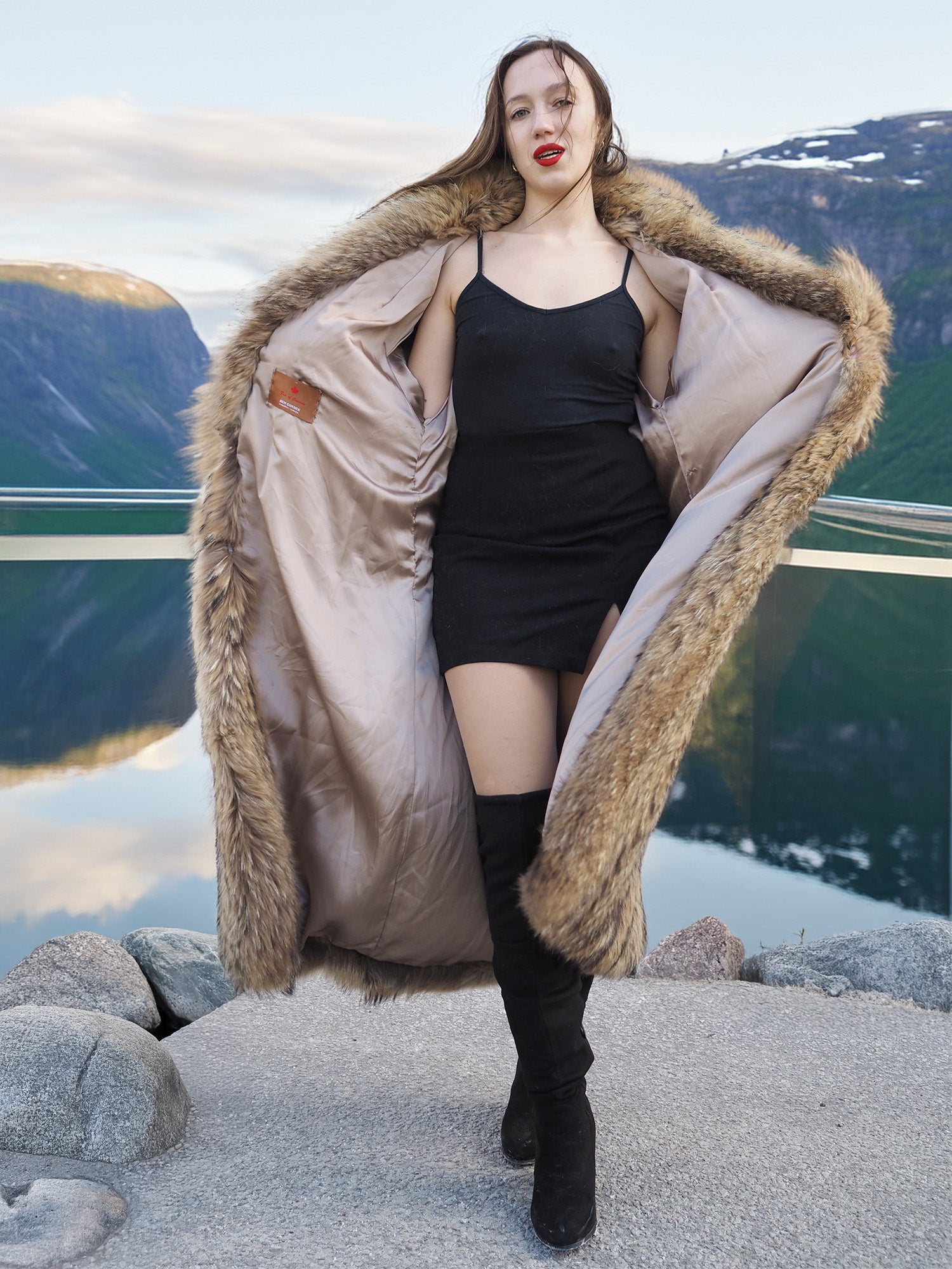 Open Finnish Raccoon Fur Coat with beige satin lining, worn over black mini dress, showcasing luxury fur fashion details.