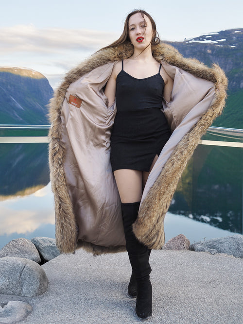 Open Finnish Raccoon Fur Coat with beige satin lining, worn over black mini dress, showcasing luxury fur fashion details.