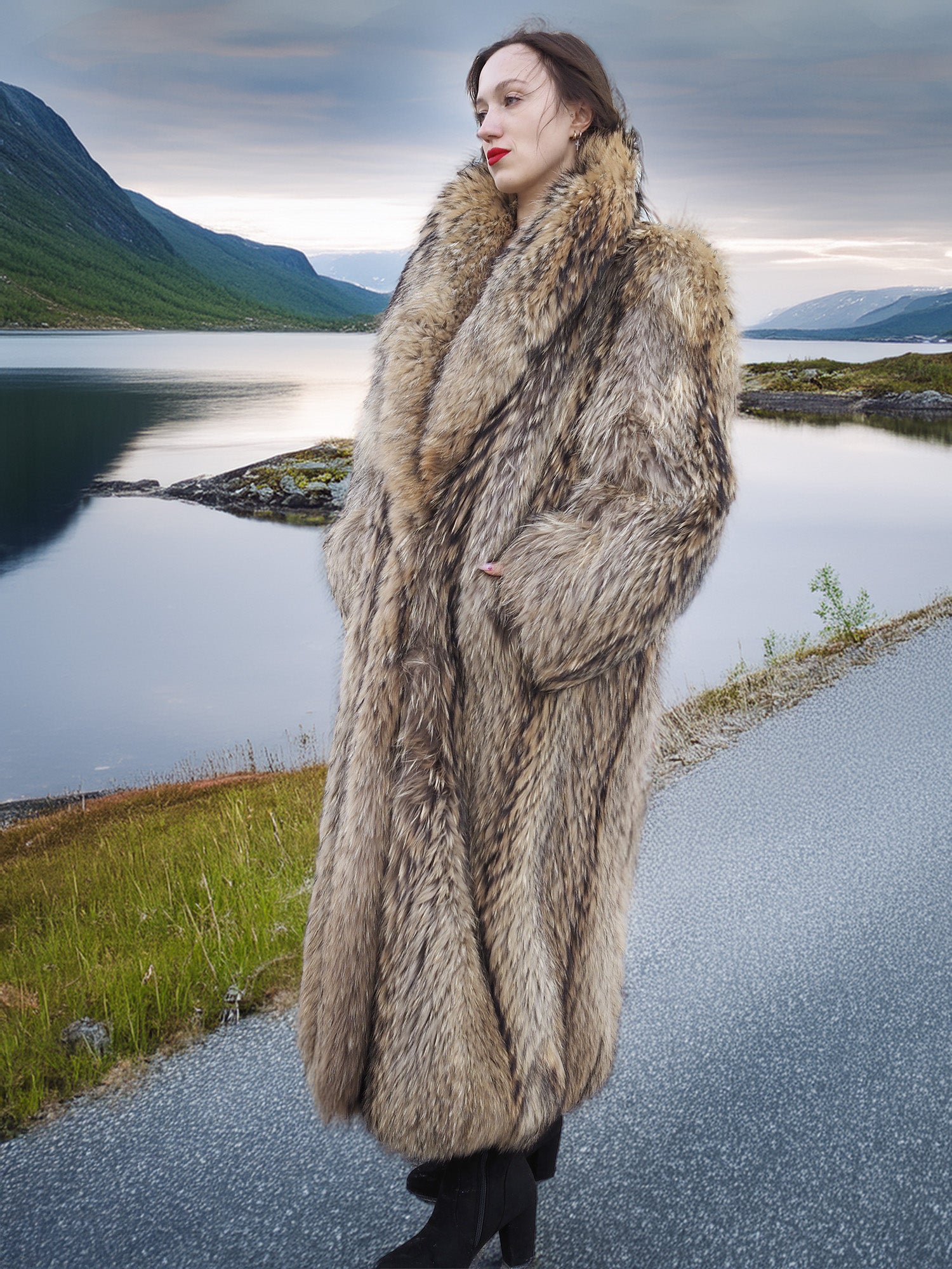 Full-length Finnish Raccoon Fur Coat with thick collar and natural fur texture, worn near a calm lake in winter setting.