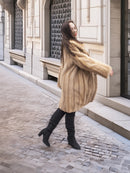 Golden Reverie M - Flowing mink coat in motion, highlighting its plush texture and elegant silhouette.