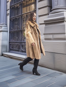 Golden Reverie M - Vintage blond mink coat with gold buttons, styled mid-stride for dynamic outerwear presentation.