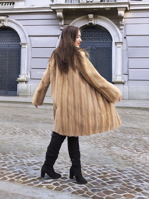 Golden Reverie M - Flowing vintage mink coat in motion, showcasing its elegant drape and plush texture from the back view.