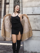 Golden Reverie M - Vintage Blond Mink Coat opened to reveal golden satin lining, paired with a black mini dress for chic contrast.