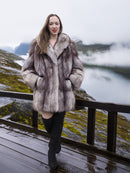 Plush soft blue fox coat with large shawl collar modeled outdoors near a misty mountain lake. Luxurious fur outerwear in M/L size for winter fashion.