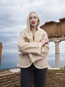 Reversible Versatile Sheared Mink Fur Jacket Coat S shown reversed with beige fabric and mink trim, worn outdoors by the sea.