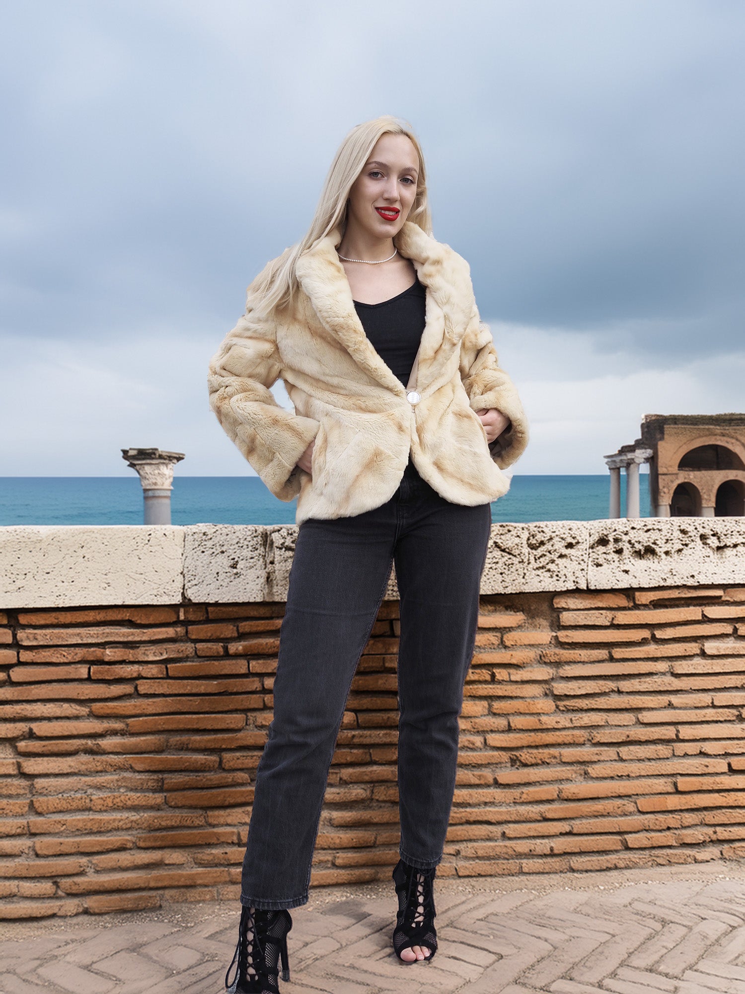 Reversible Versatile Sheared Mink Fur Jacket Coat S in soft fur texture, styled with dark jeans, posed near historic ruins and sea.