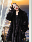 Woman wearing a black fur coat with a blurred background