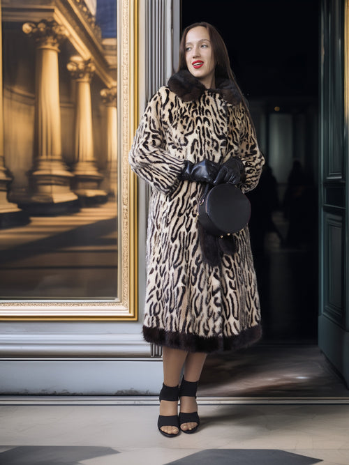 Woman in a leopard print coat standing in a doorway with a painting in the background