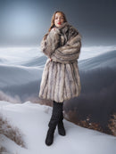 Person wearing a fur coat standing in a snowy landscape