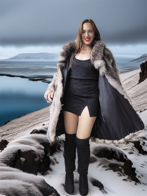 Woman in a fur coat standing on a snowy landscape with mountains in the background