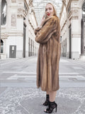 a woman in a fur coat talking on a cell phone