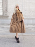 Luxurious vintage Canadian brown mink fur coat, showcasing an opulent design and exquisite craftsmanship.