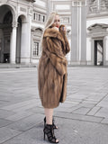 Opulent vintage Canadian brown mink fur coat showcased in grand architectural setting