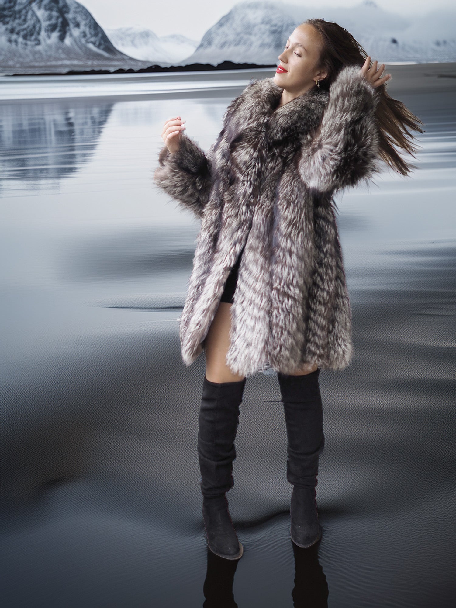 Woman in a fur coat standing in a snowy landscape with mountains in the background