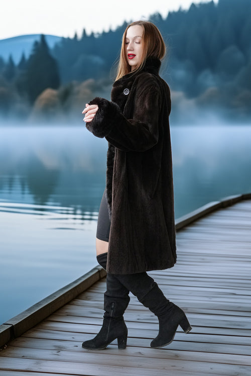 Dark fur button-front coat with stand collar and sleeve cuffs, walking view