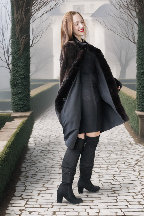 Black mink coat with full button front, oversized collar, and flared hem
