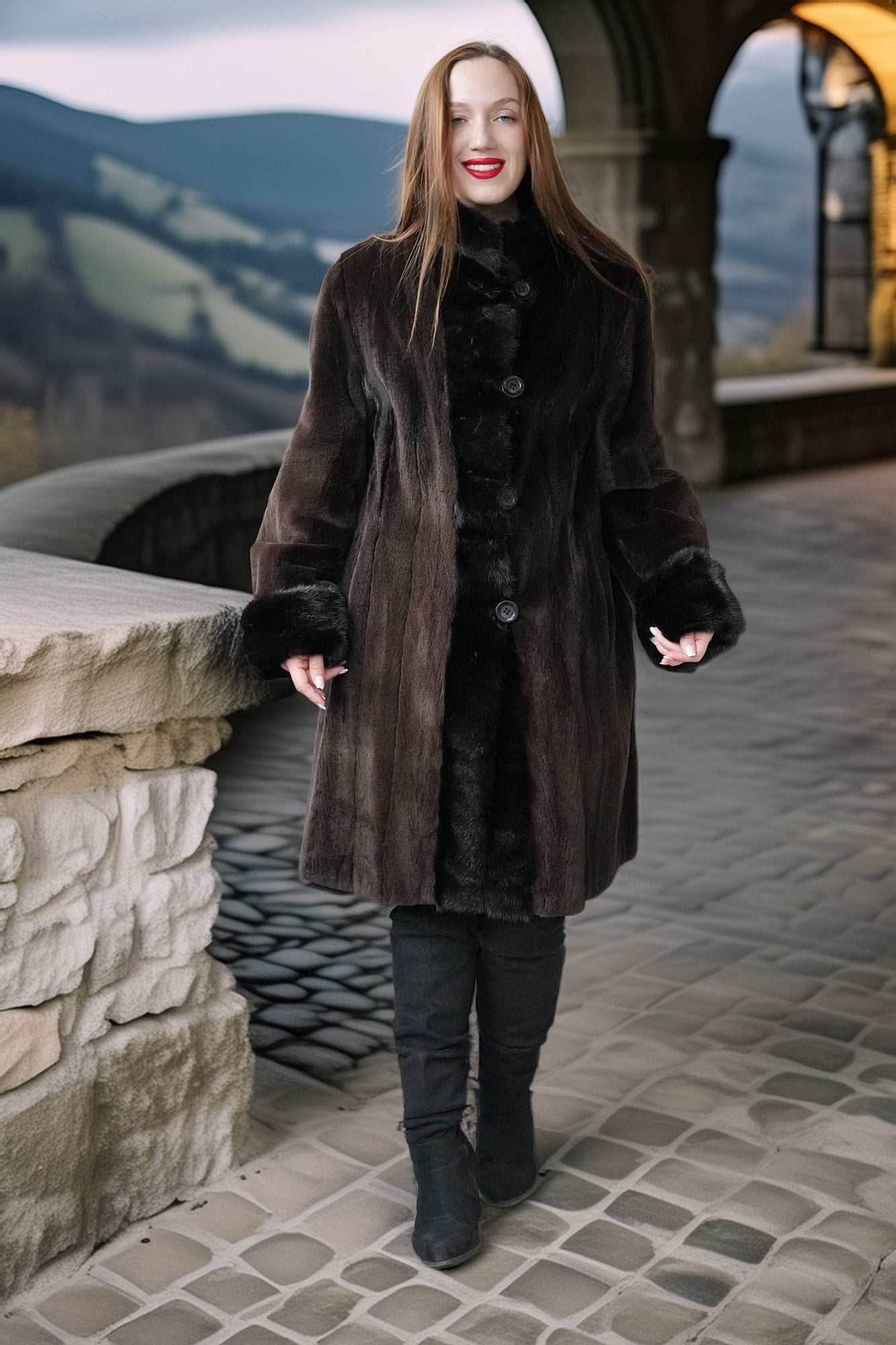 Long dark mink coat with front buttons, plush fur cuffs, and structured sheared sleeves