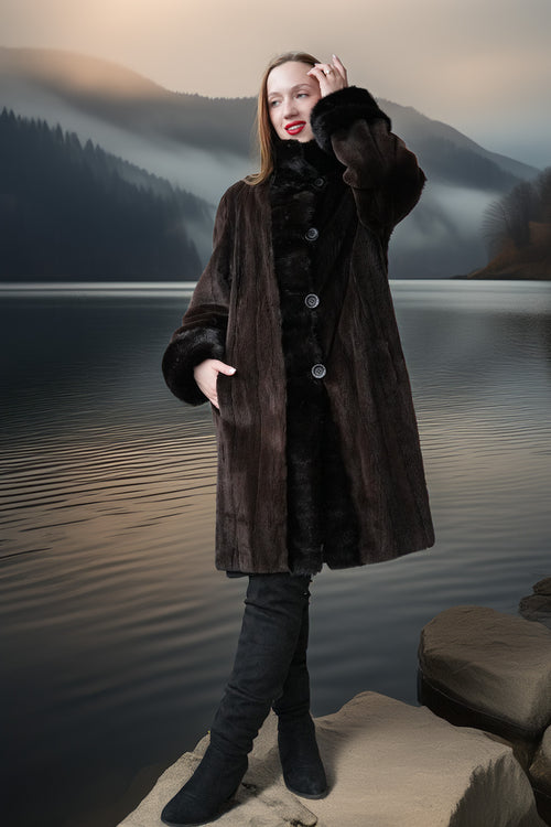 Long dark mink coat with sheared texture, front buttons, and thick fur collar/cuffs