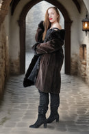 Long dark mink coat with fur hood/collar, button front, and plush fur-trimmed sleeves