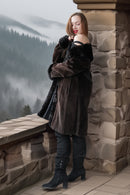 Dark mink coat with thick fur collar and button front, cropped view showing inner neckline