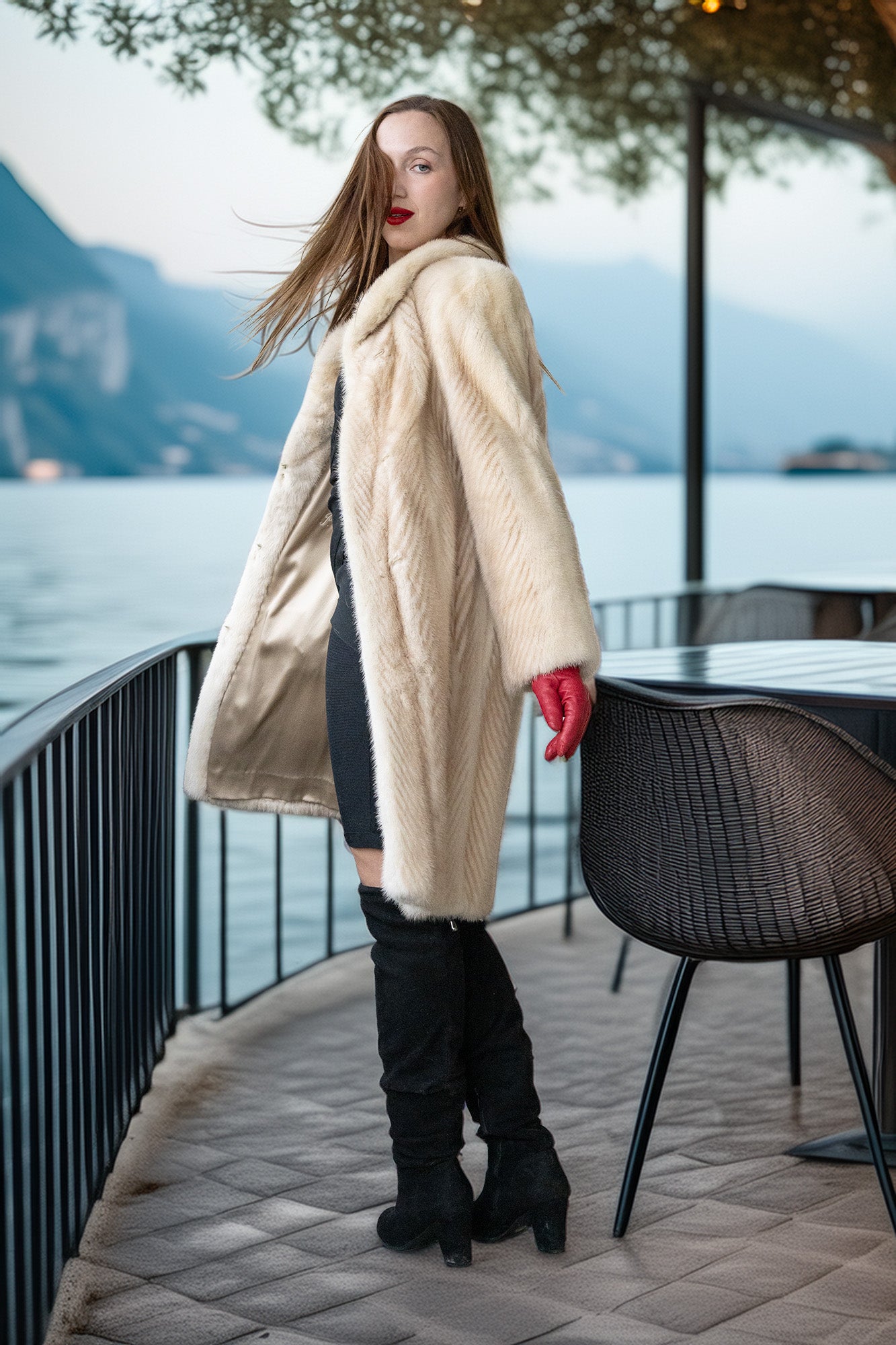 Ivory mink coat side view with plush collar and red gloves