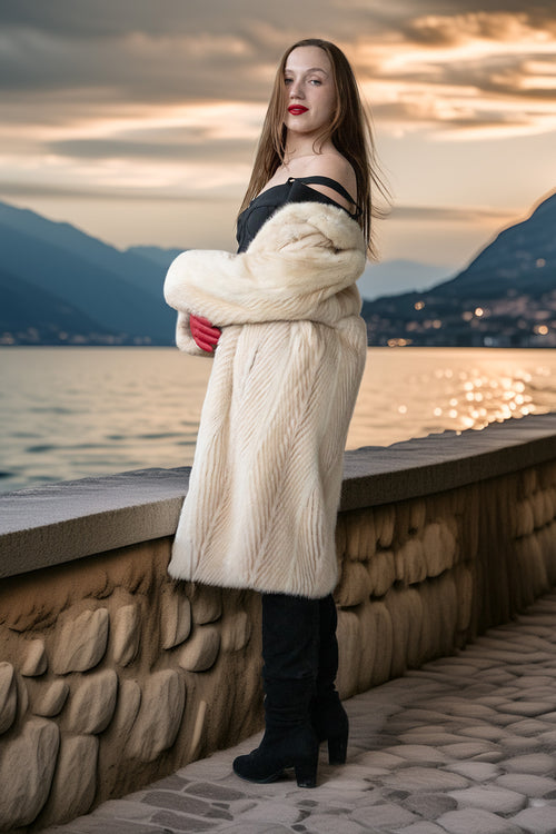 Ivory mink coat with thick collar and red gloves, mid-thigh length