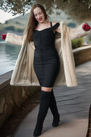Ivory faux mink coat draped over shoulders with open front and wide collar