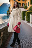 Ivory faux mink coat front view with plush collar and defined vertical fur pattern