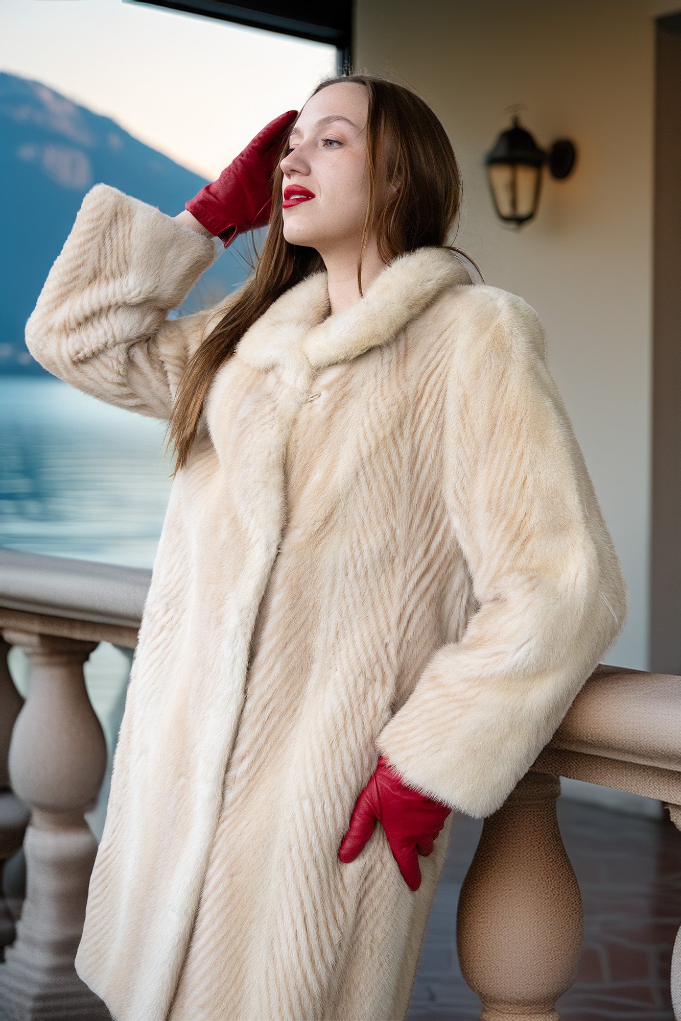 Ivory mink coat detail with fur collar and red gloves, relaxed drape