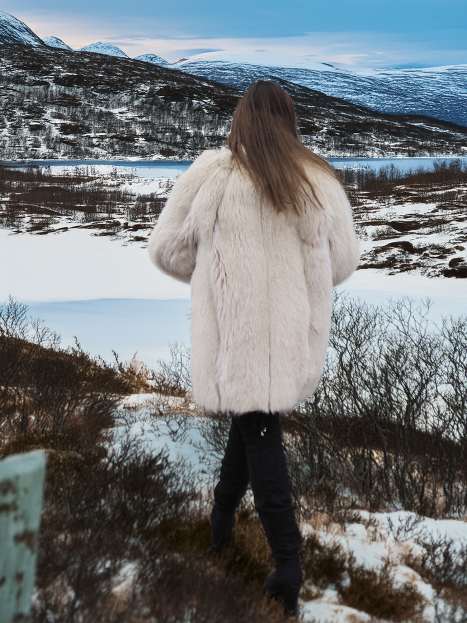 Back view of Soft Plush Blush Fox Jacket S/M in snowy terrain, highlighting the coat’s full fur texture and winter elegance.