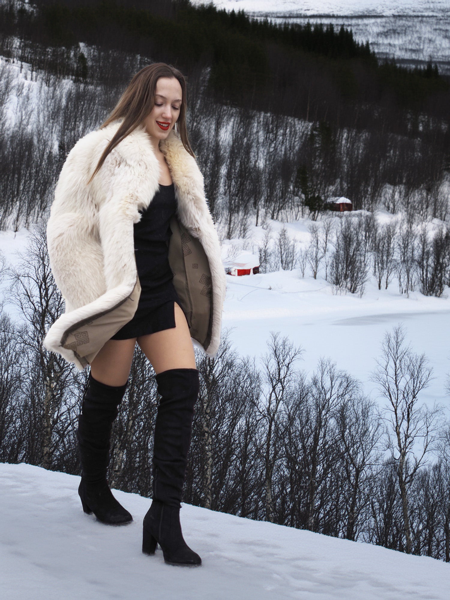 Model walking in snow with Soft Plush Blush Fox Jacket S/M draped over shoulders, revealing satin lining and winter-ready style.