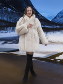 Soft Plush Blush Fox Jacket S/M displayed in a winter landscape, emphasizing its thick fox fur and luxurious outerwear design.