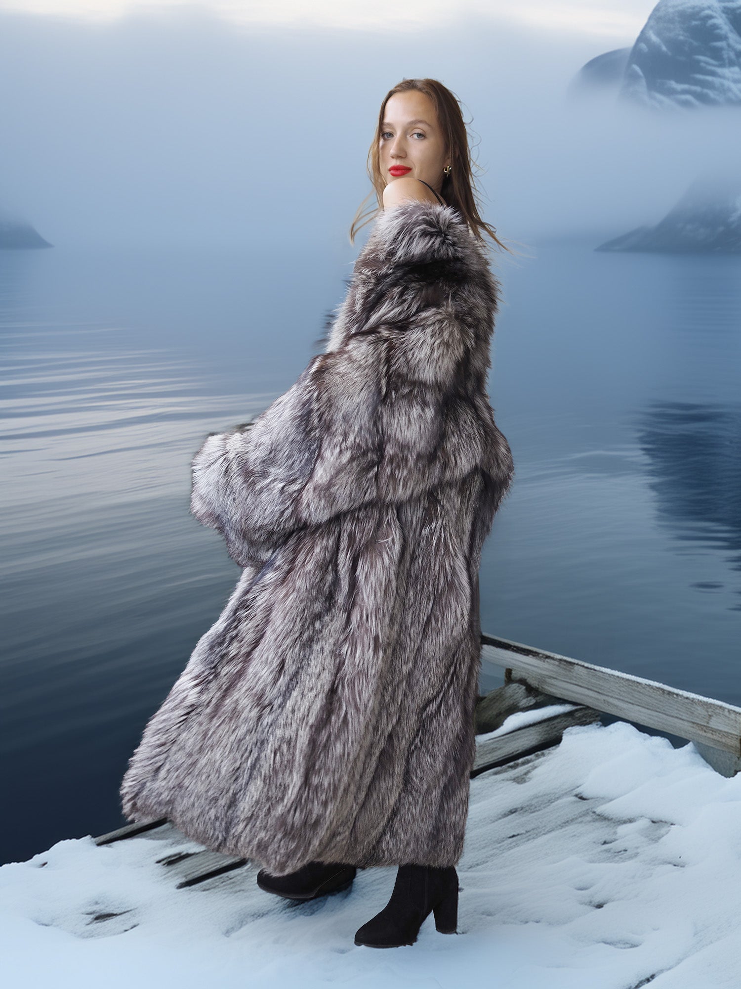 Woman in a fur coat standing on a snowy dock with a mountainous background