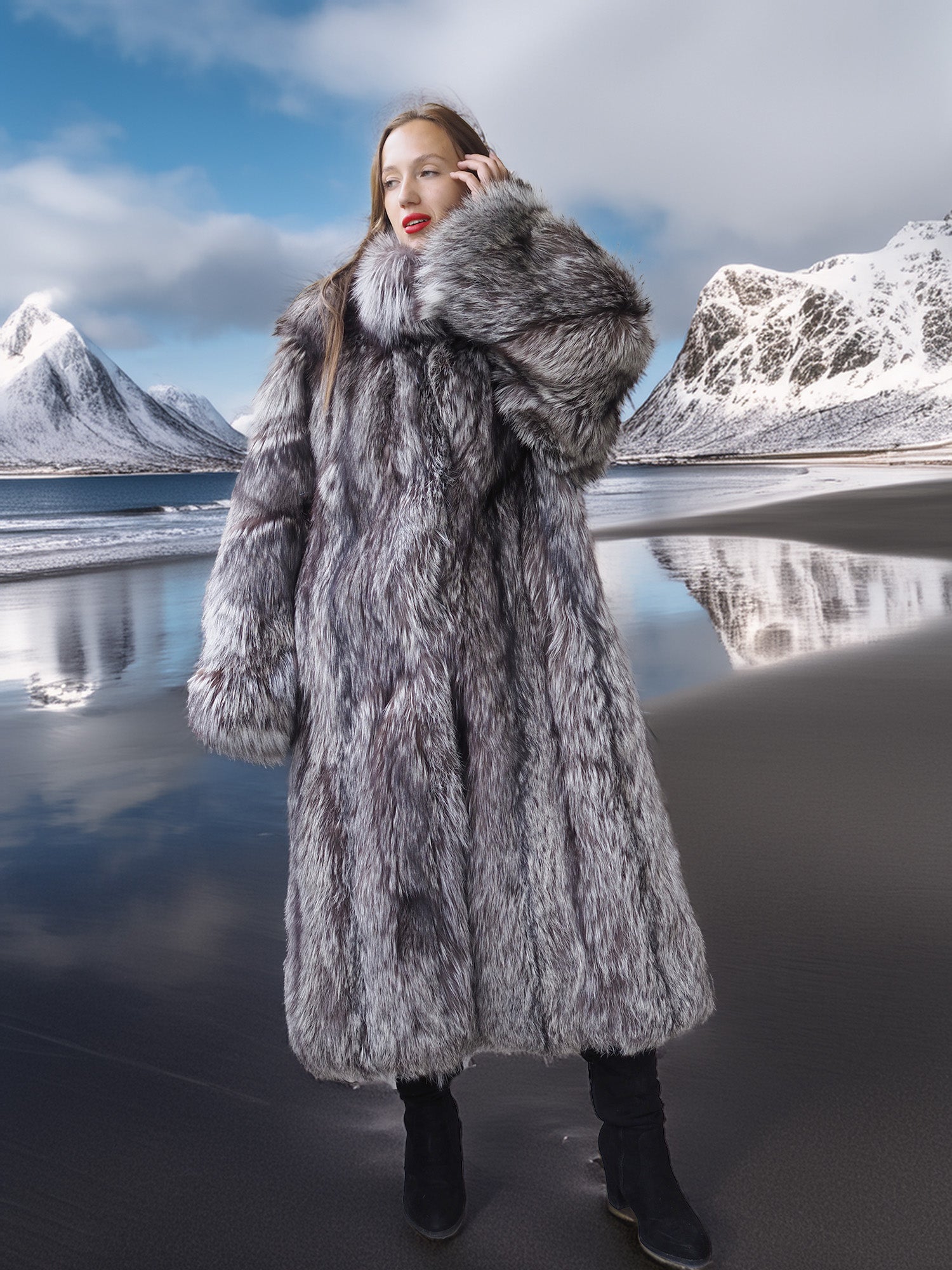 Woman wearing a fur coat standing in front of a scenic mountain landscape with water.
