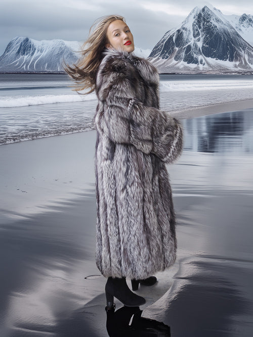 Woman in a fur coat standing on a snowy landscape with mountains in the background