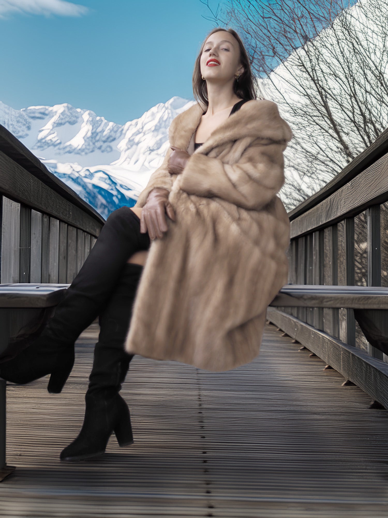 Woman in a fur coat sitting on a wooden bridge with mountains in the background