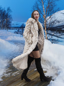 Two Tone Fox Coat Size XS/S worn open while walking on a snowy path, emphasizing the coat’s soft lining and chevron fur texture.