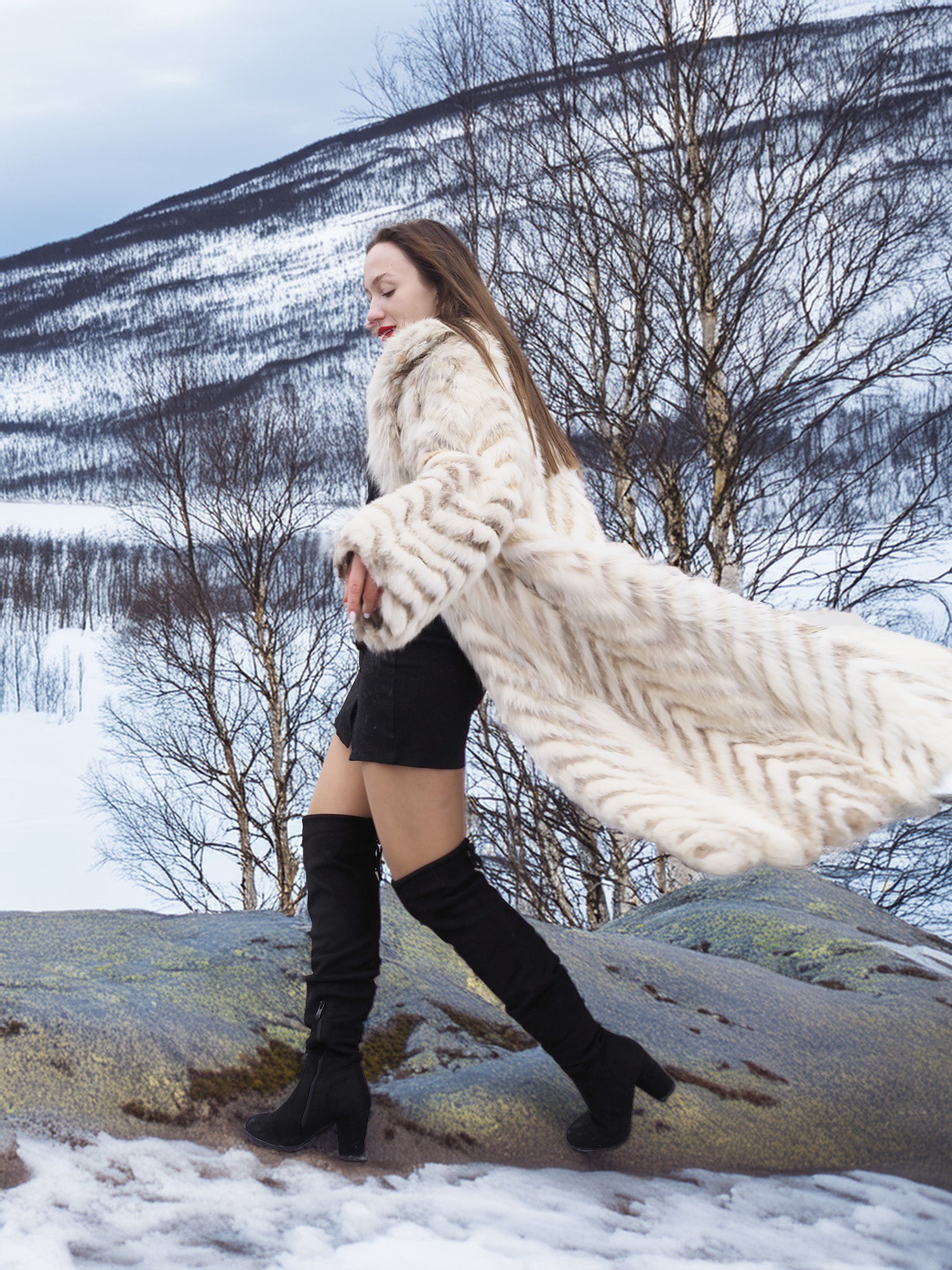 Model walking in Two Tone Fox Coat Size XS/S with coat flowing open, showcasing chevron fur and stylish winter outerwear.