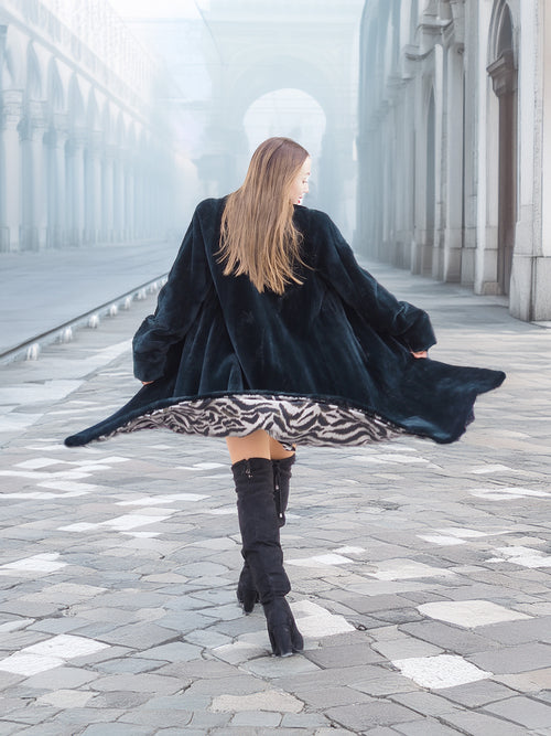 Back view of Sheard Deep Emerald Green Mink Fur Coat M Excellent in motion, revealing zebra-print lining and full-length fur elegance for winter fashion.