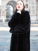 Close-up of model in Sheard Deep Emerald Green Mink Fur Coat M Excellent, highlighting soft fur and elegant collar for luxury cold-weather wear.